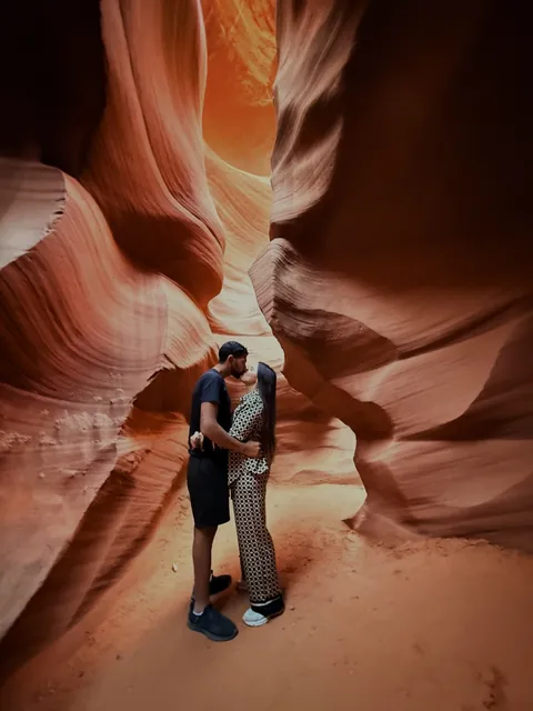 Julia and Nouh in a sandstone canyon