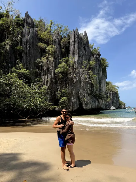 Julia and Nouh on a tropical beach