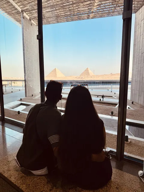 Julia and Nouh looking out toward the pyramids